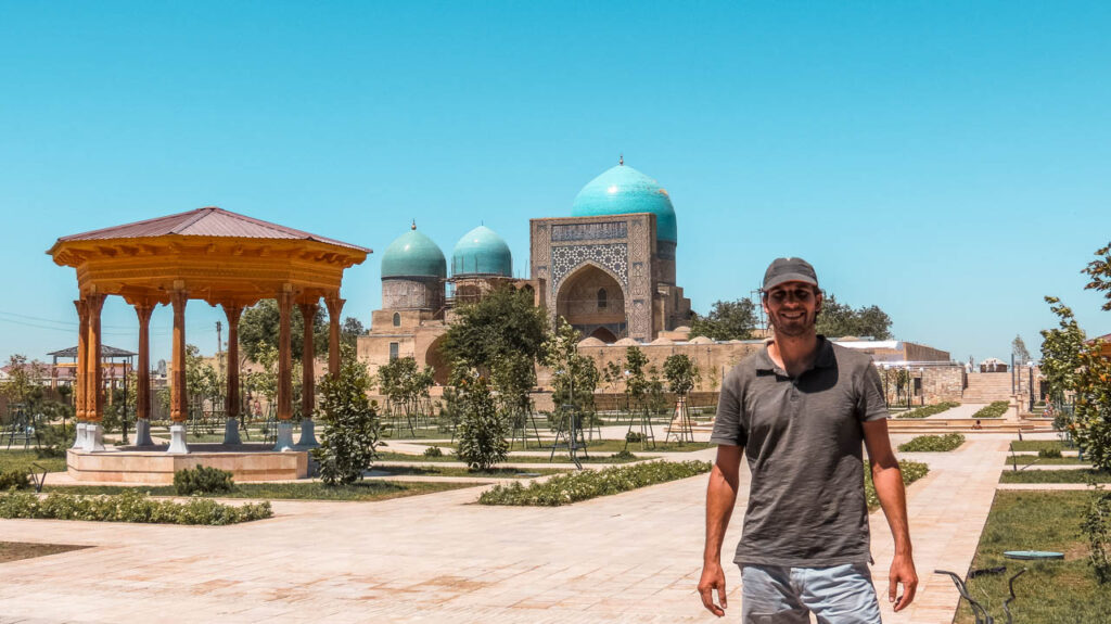 Juan in front of the Dorut Tilovat Complex, one of the places to see in Shahrisabz.