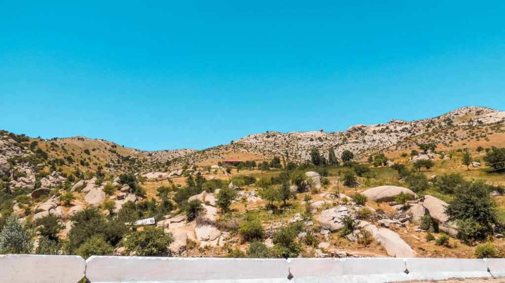 Mountain scenery, somewhat arid, typical of the road between Shahrisabz and Samarkand.